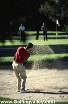 A golf shot out of deep sand
